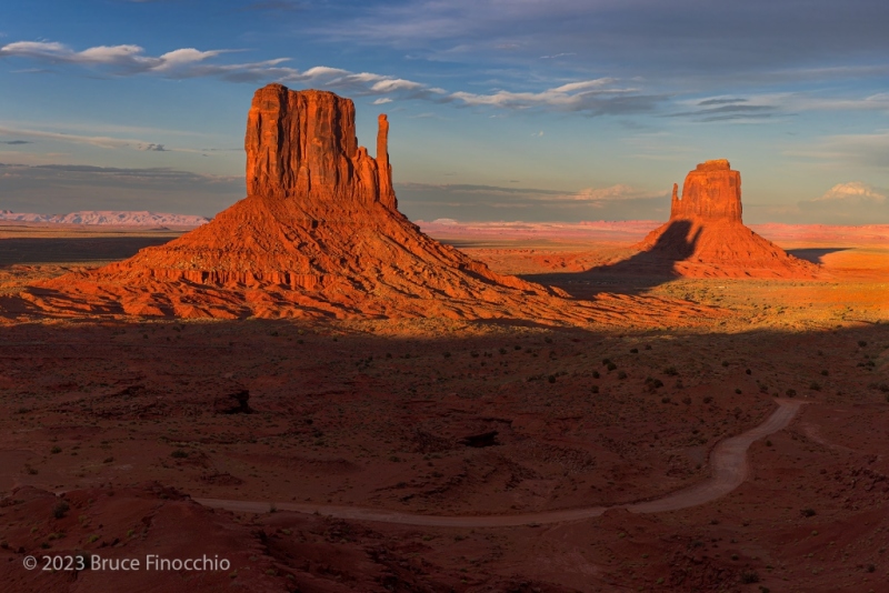 Shadow Of The West Mitten Butte Creeps Up The East Mitten Butte,  Monument Valley